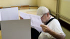 A man reads a polling list at a polling station during a parliamentary election in Zagreb, Croatia, September 11, 2016. REUTE