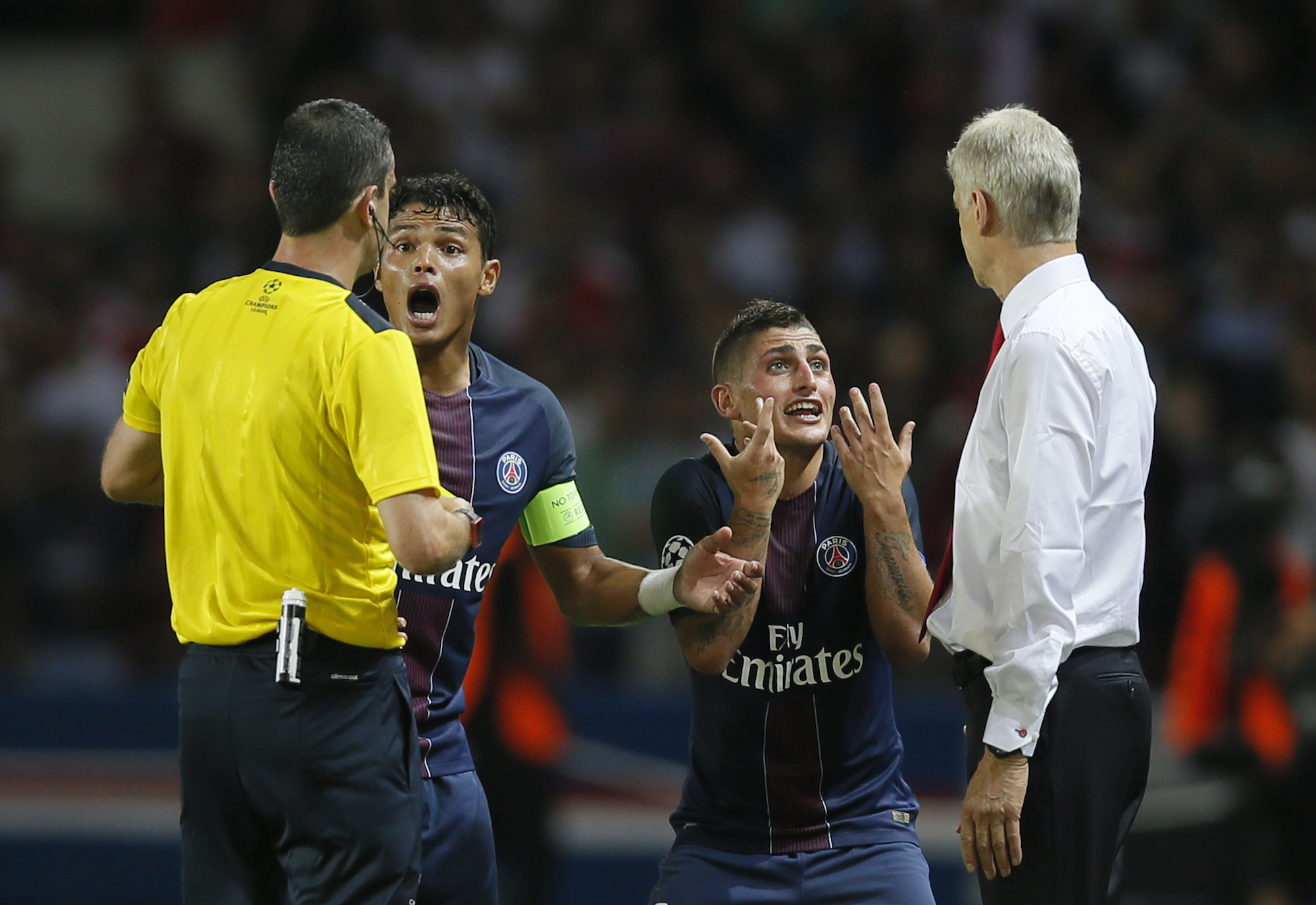 Football Soccer - Paris Saint-Germain v Arsenal - UEFA Champions League Group Stage - Group A - Parc des Princes, Paris, France - 13/9/16 Paris Saint-Germain's Marco Verratti after being shown a red card by referee Viktor Kassai as Arsenal manager Arsene Wenger looks on Reuters / Gonzalo Fuentes Livepic EDITORIAL USE ONLY.