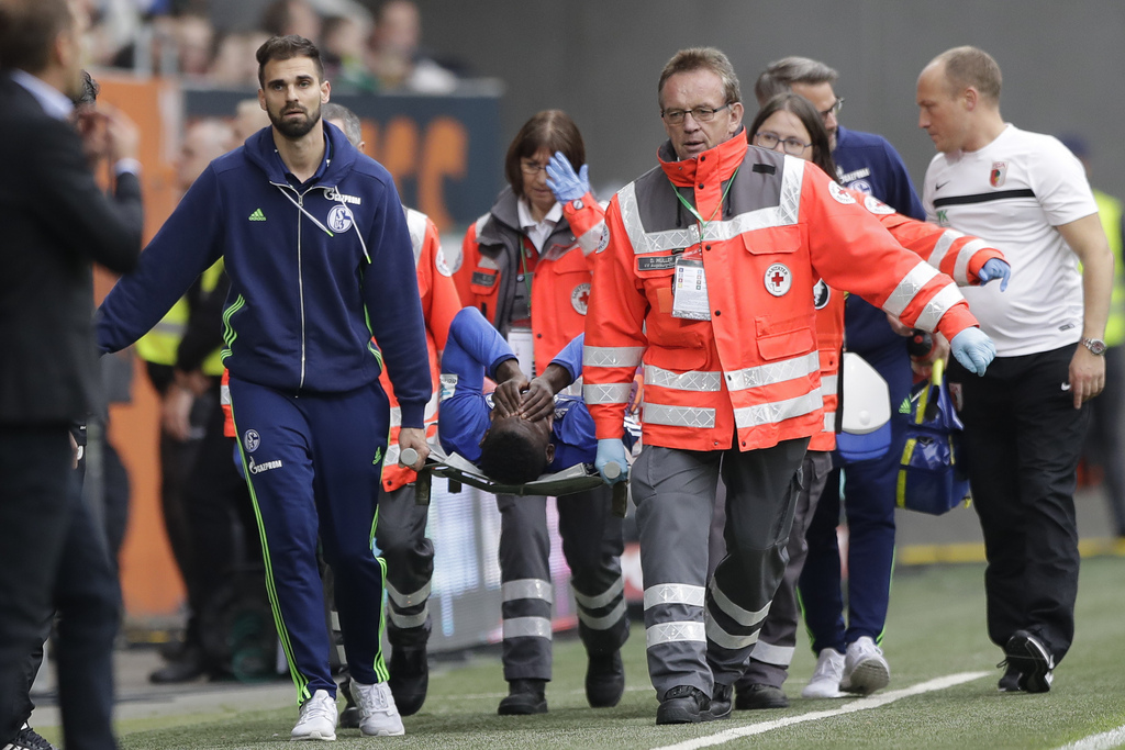 Schalke's Breel Embolo leaves the field on a stretcher during the German Bundesliga soccer match between FC Augsburg and FC Schalke 04 in Augsburg, Germany, Saturday, Oct. 15, 2016. (AP Photo/Matthias Schrader)