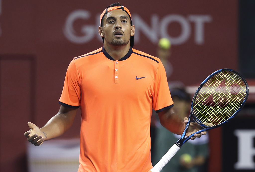FILE - In this Saturday, Oct. 8, 2016, file photo, Australia's Nick Kyrgios reacts after getting a point against Gael Monfils of France during the semifinal match of Japan Open tennis championships in Tokyo. The ATP has suspended Nick Kyrgios for at least 3 weeks and fined him extra $25,000 for conduct contrary to 'integrity' of tennis. (AP Photo/Koji Sasahara, File)