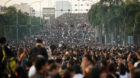 Mourners leave the procession route of a motorcade carrying the body of Thailand's King Bhumibol Adulyadej in Bangkok, Thaila