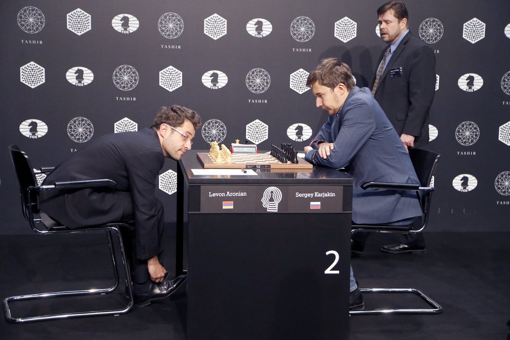 epa05232798 Sergey Karjakin (R) of Russia plays against Levon Aronian (L) of Armenia during the FIDE World Chess Candidates Tournament in Moscow, Russia, 27 March 2016. The event which determines the next Challenger to Magnus Carlsen's title, will take place in Moscow from 10 through 30 March. EPA/MAXIM SHIPENKOV
