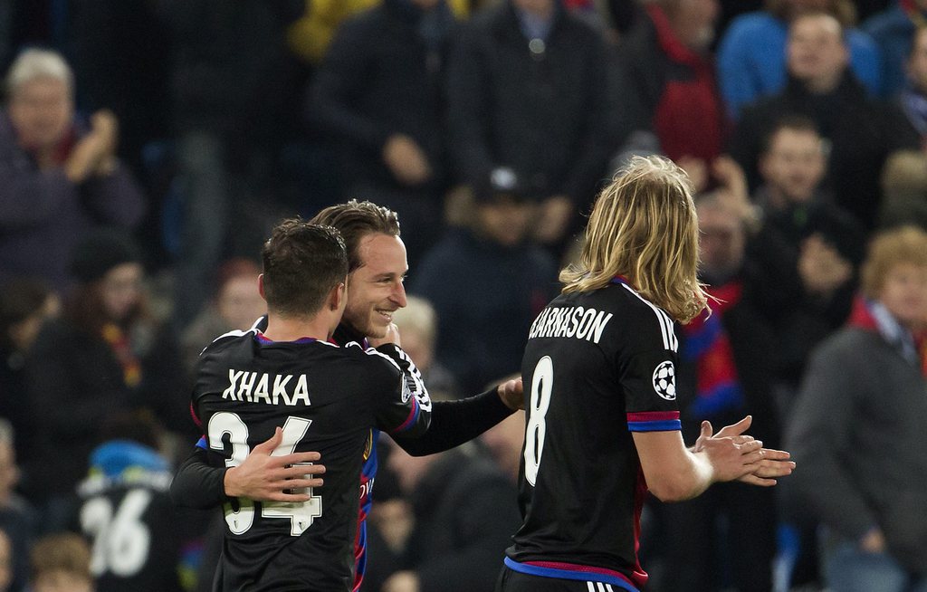 epa05613218 Basel's defender Marek Suchy, center, celebrates his goal with Basel's midfielder Taulant Xhaka, left, and Basel's midfielder Birkir Bjarnason, right, during an UEFA Champions League Group stage Group A matchday 4 soccer match between Switzerland's FC Basel 1893 and France's Paris Saint-Germain Football Club, at the St. Jakob-Park stadium in Basel, Switzerland, Tuesday, November 1, 2016. EPA/SALVATORE DI NOLFI