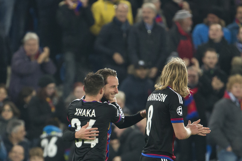 Basel's defender Marek Suchy, center, celebrates his goal with Basel's midfielder Taulant Xhaka, left, and Basel's midfielder Birkir Bjarnason, right, during an UEFA Champions League Group stage Group A matchday 4 soccer match between Switzerland's FC Basel 1893 and France's Paris Saint-Germain Football Club, at the St. Jakob-Park stadium in Basel, Switzerland, Tuesday, November 1, 2016. (KEYSTONE/Salvatore Di Nolfi)