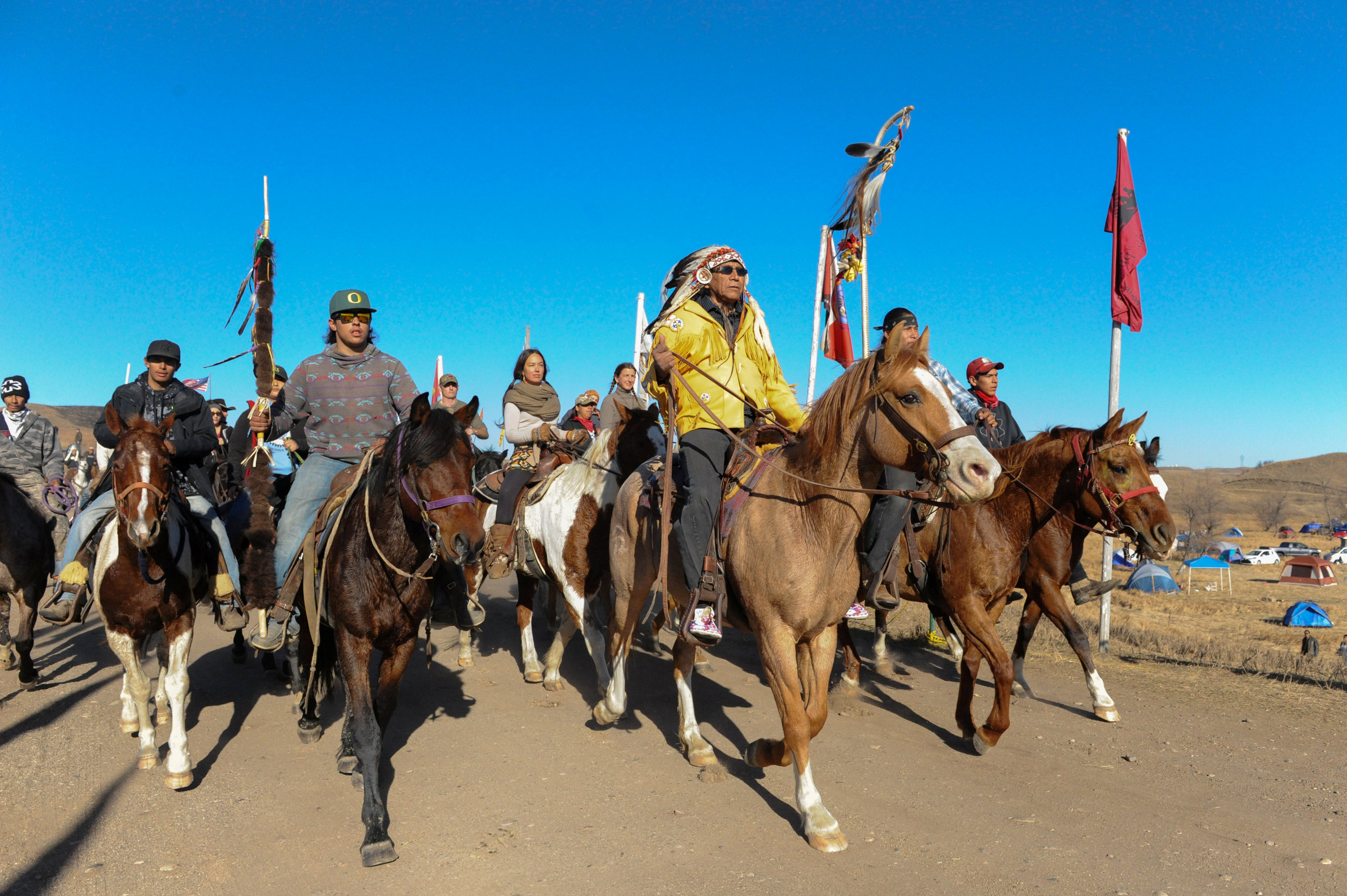 REFILE - CLARIFYING LOCATION Horse riders from the Bigfoot Riders, Dakota 38 Riders, Spirit Riders and the Bigfoot Youth Riders arrive at the Oceti Sakowin camp during a protest of the Dakota Access pipeline near the Standing Rock Indian Reservation near Cannon Ball, North Dakota November 5, 2016. REUTERS/Stephanie Keith