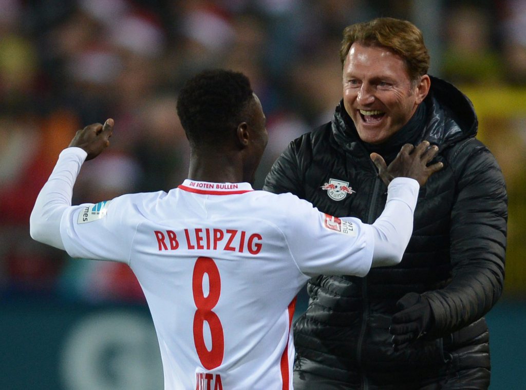 epa05647605 Naby Deco Keita (L) of Leipzig celebrates scoring the opening goal with head coach Ralph Hasenhuettl during the German Bundesliga match SC Freiburg vs RB Leipzig in Freiburg, Germany, 25 November 2016.....(ATTENTION: Due to the accreditation guidelines, the DFL only permits the publication and utilisation of up to 15 pictures per match on the internet and in online media during the match.) EPA/PATRICK SEEGER