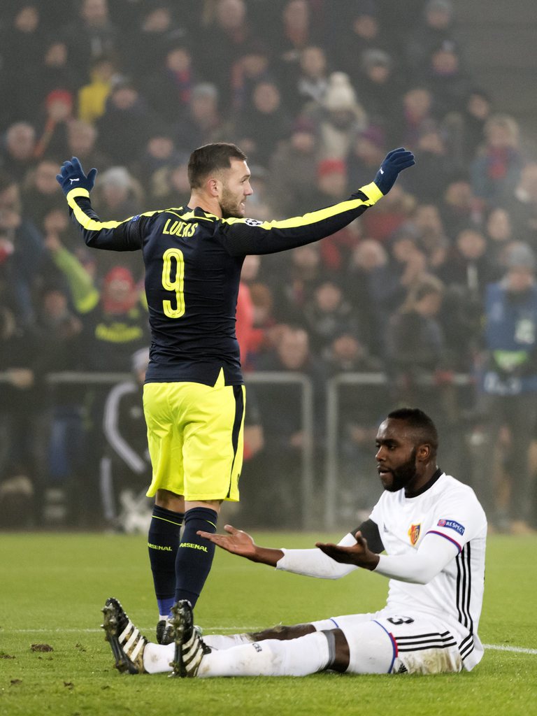 epa05662956 Arsenal's Lucas Perez (L) cheers after his second goal during an UEFA Champions League Group stage Group A soccer match between FC Basel 1893 and Arsenal FC at the St. Jakob-Park stadium in Basel, Switzerland, 06 December 2016. EPA/GEORGIOS KEFALAS