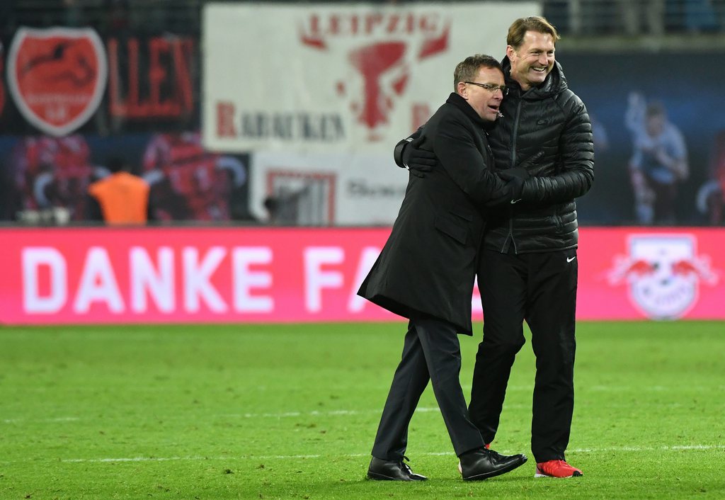 epa05679876 RB sporting director Ralf Rangnick (l) and head coach Ralph Hasenhuettl are pleased with their team's victory in the German Bundesliga football match between RB Leipzig and Hertha BSC at the Red Bull Arena in Leipzig, Germany, 17 December 2016. ..(EMBARGO CONDITIONS - ATTENTION: Due to the accreditation guidlines, the DFL only permits the publication and utilisation of up to 15 pictures per match on the internet and in online media during the match.) EPA/HENDRIK SCHMIDT