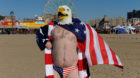 A man wearing an United States flag themed outfit prepares to participate in the annual Polar Bear Plunge in Coney Island in 