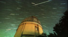 Stars spin across the photograph during a time exposure of the 36-inch Spacewatch telescope at Kitt Peak National Observatory