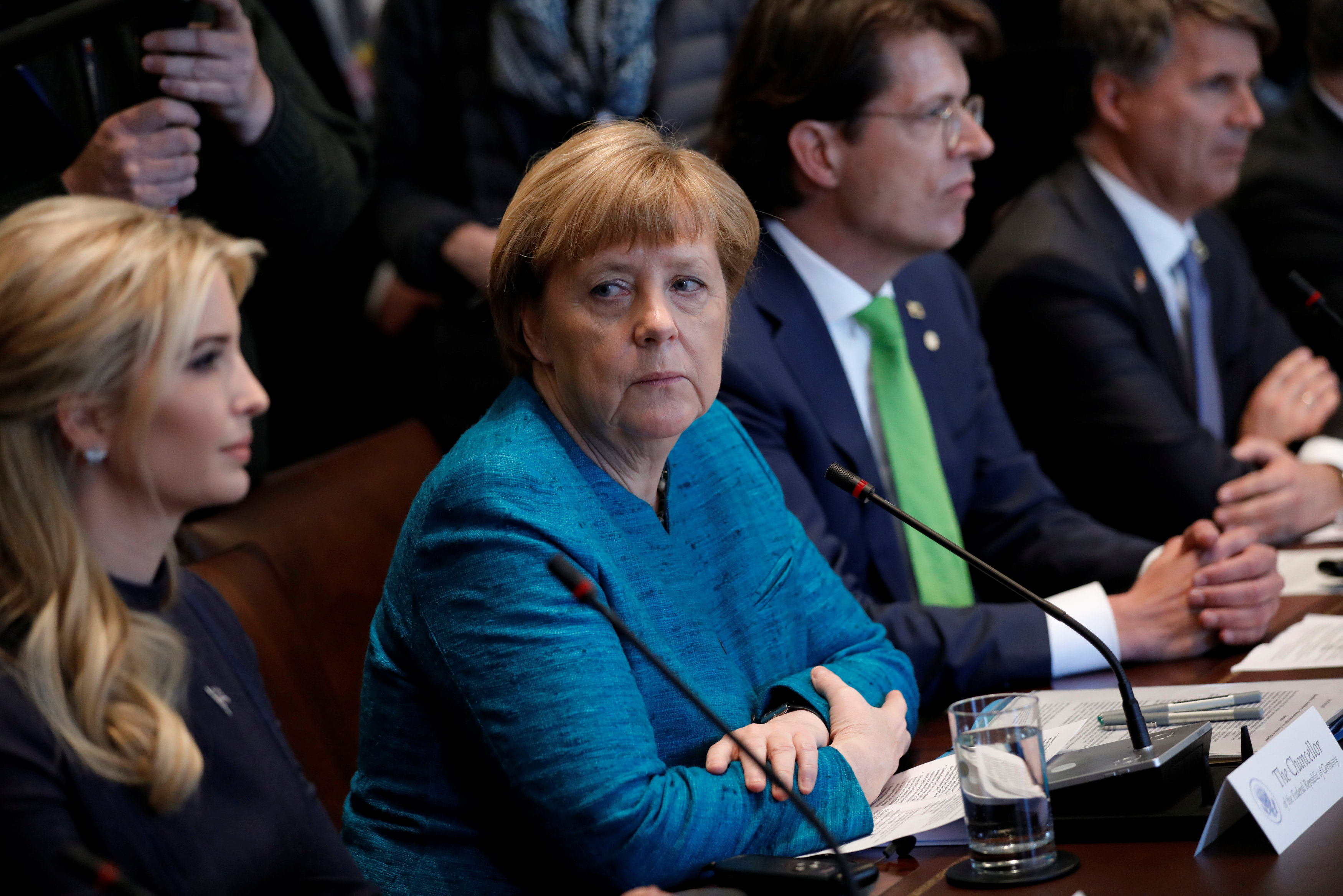 Germany's Chancellor Angela Merkel, flanked by Ivanka Trump and Schaeffler CEO Klaus Rosenfeld (3rd L), participates in a roundtable with U.S. President Donald Trump and German and U.S. business leaders at the White House in Washington, U.S. March 17, 2017. REUTERS/Jonathan Ernst