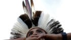 A Brazilian Indian takes part in a demonstration against the violation of indigenous people's rights, in Brasilia, Brazil Apr