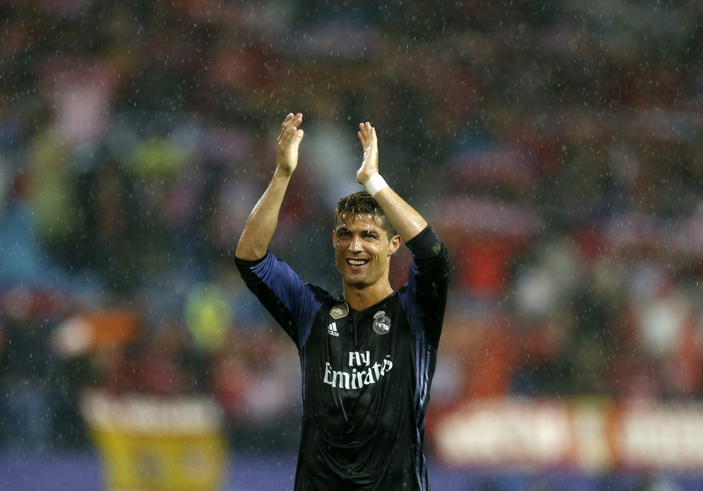 Real Madrid's Cristiano Ronaldo waves to their fans after the Champions League semifinal second leg soccer match between Atletico Madrid and Real Madrid at the Vicente Calderon stadium in Madrid, Spain, Wednesday, May 10, 2017. (AP Photo/Francisco Seco)