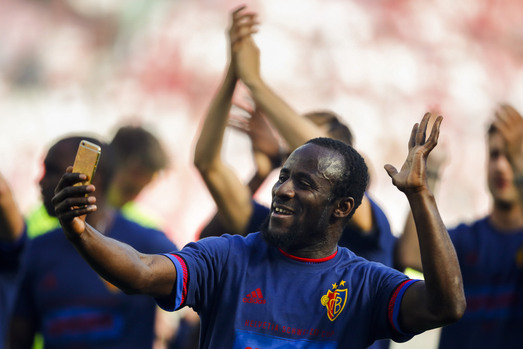 Basel's forward Seydou Doumbia of Ivory Coast takes a selfie as he celebrates his team's ictory after the Swiss Cup final soccer match between FC Basel 1893 and FC Sion at the stade de Geneve stadium, in Geneva, Switzerland, Thursday, May 25, 2017. (KEYSTONE/Valentin Flauraud)