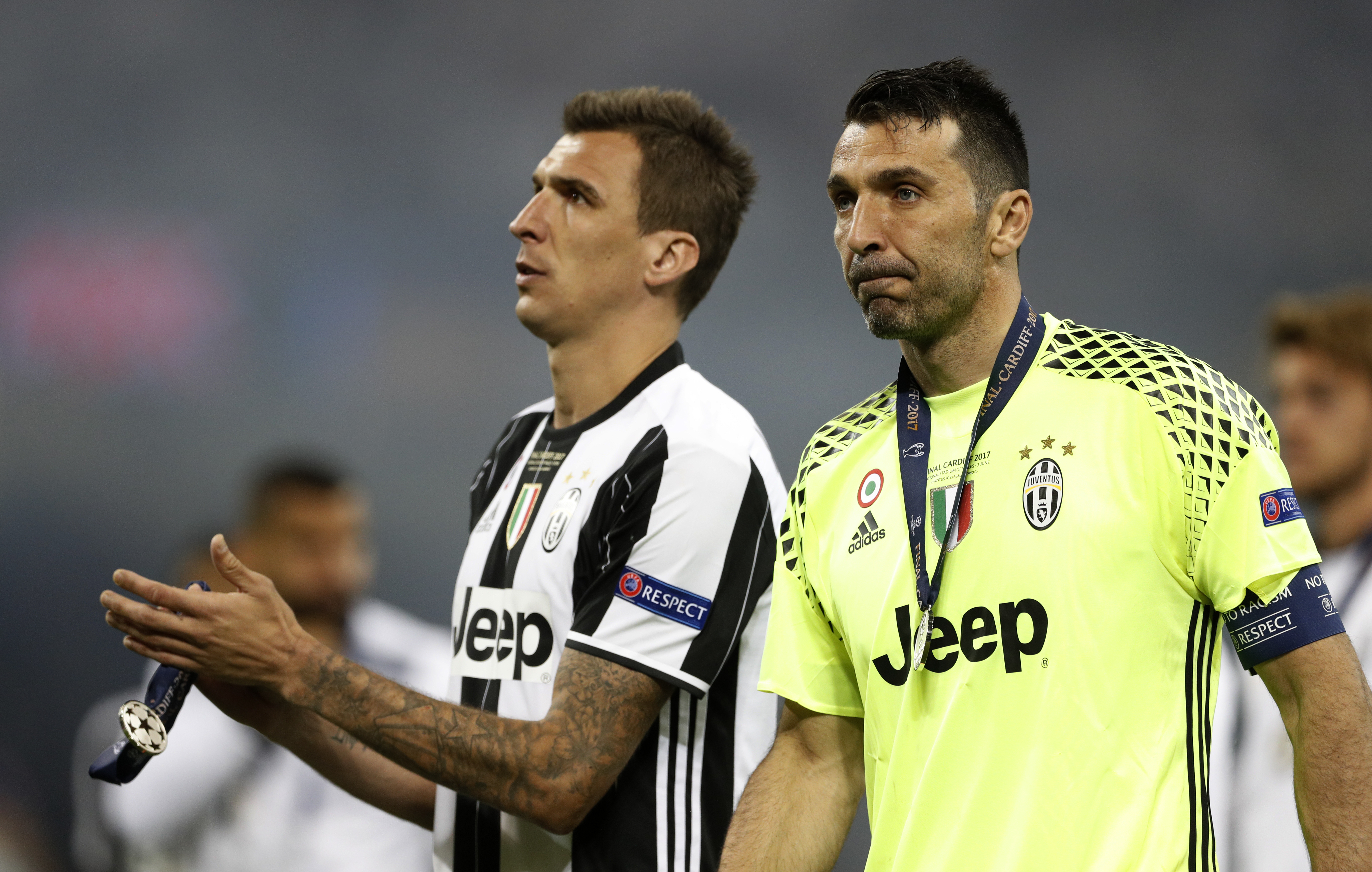 Britain Soccer Football - Juventus v Real Madrid - UEFA Champions League Final - The National Stadium of Wales, Cardiff - June 3, 2017 Juventus' Mario Mandzukic and Gianluigi Buffon look dejected after the match Reuters / John Sibley Livepic