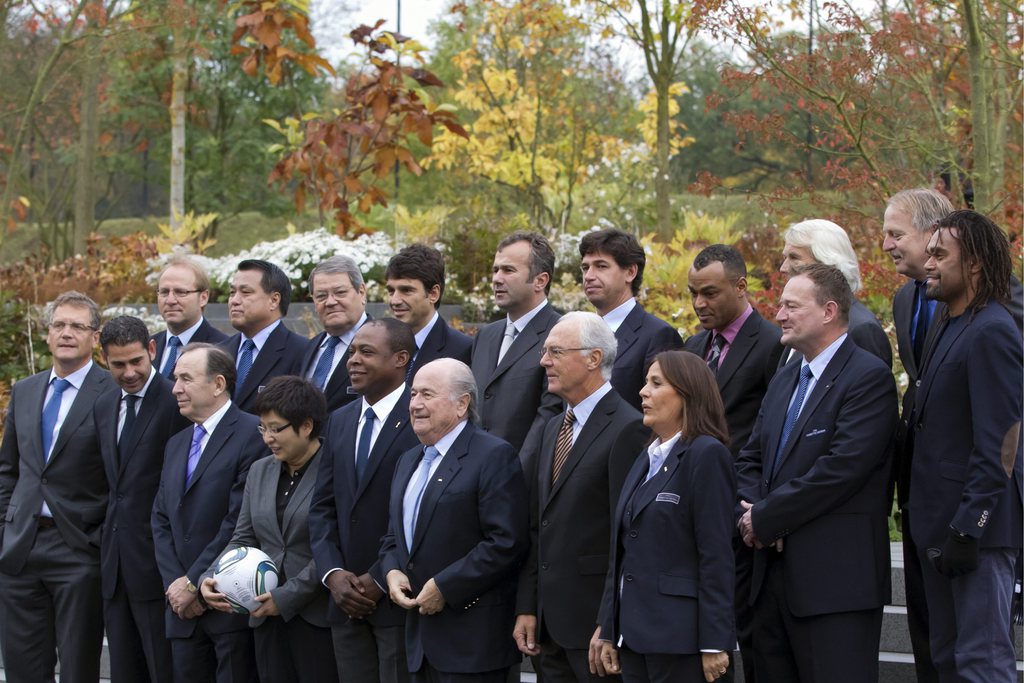 Members of the FIFA Football Task Force 2014 pose for a group photograph, Tuesday, October 25, 2011 in front of the Home of FIFA in Zurich, Switzerland. Front row, from left: FIFA Secretary General Jerome Valcke, Fernando Hierro of Spain, Ivan Curkovic of Serbia, Tracy Lu of China, Chairman Kalusha Bwalya of Zambia, FIFA President Joseph Blatter, Chairman Franz Beckenbauer of Germany and Marina Sbardella of Italy. Back row, from left: Jean-Paul Brigger of Switzerland, Kozo Tashima of Japan, Carlos Alarcon of Paraguay, Massimo Busacca of Switzerland, Dejan Savicevic of Montenegro, Demetrio Albertini of Italy, Cafu (Marcos Evangelista de Moraes) of Brazil, Jiri Dvorak of Switzerland, Peter Mikkelsen of Denmark, Theo van Seggelen of Netherlands, and Christian Karembeu of France. (KEYSTONE/Alessandro Della Bella)