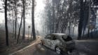 A burned car is seen in the aftermath of a forest fire near Pedrogao Grande, in central Portugal, June 18, 2017.  REUTERS/Raf
