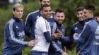 Argentina's Lionel Messi, center, shares a light moment with teammates as they train for a 2018 Russia World Cup qualifying s