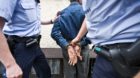 Three municipal police officers of Zurich's special unit SOKO Uno 44 search and arrest a man who is not allowed to stay in th