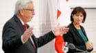 Swiss President Doris Leuthard listens as European Commission President Jean-Claude Juncker speaks during a news conference i