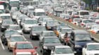 Commuters are stuck in a traffic jam during rush hour in Beijing July 9, 2008. Two key measures of pollution in China have fa