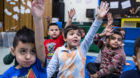 STERLING, VA - FEB6:  Kindergarten student Ronny Vaca (center) raises his hand in music class at Guilford Elementary school, 